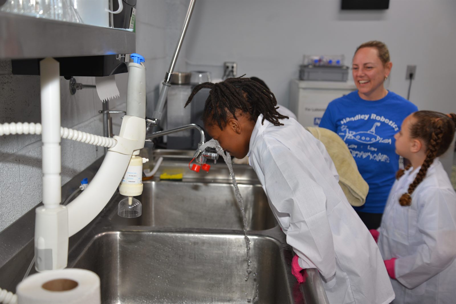 MiLab students conducting experiments at the lab station