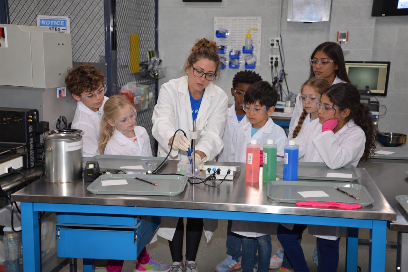 Instructor demonstrating a pH experiment to MiLab students